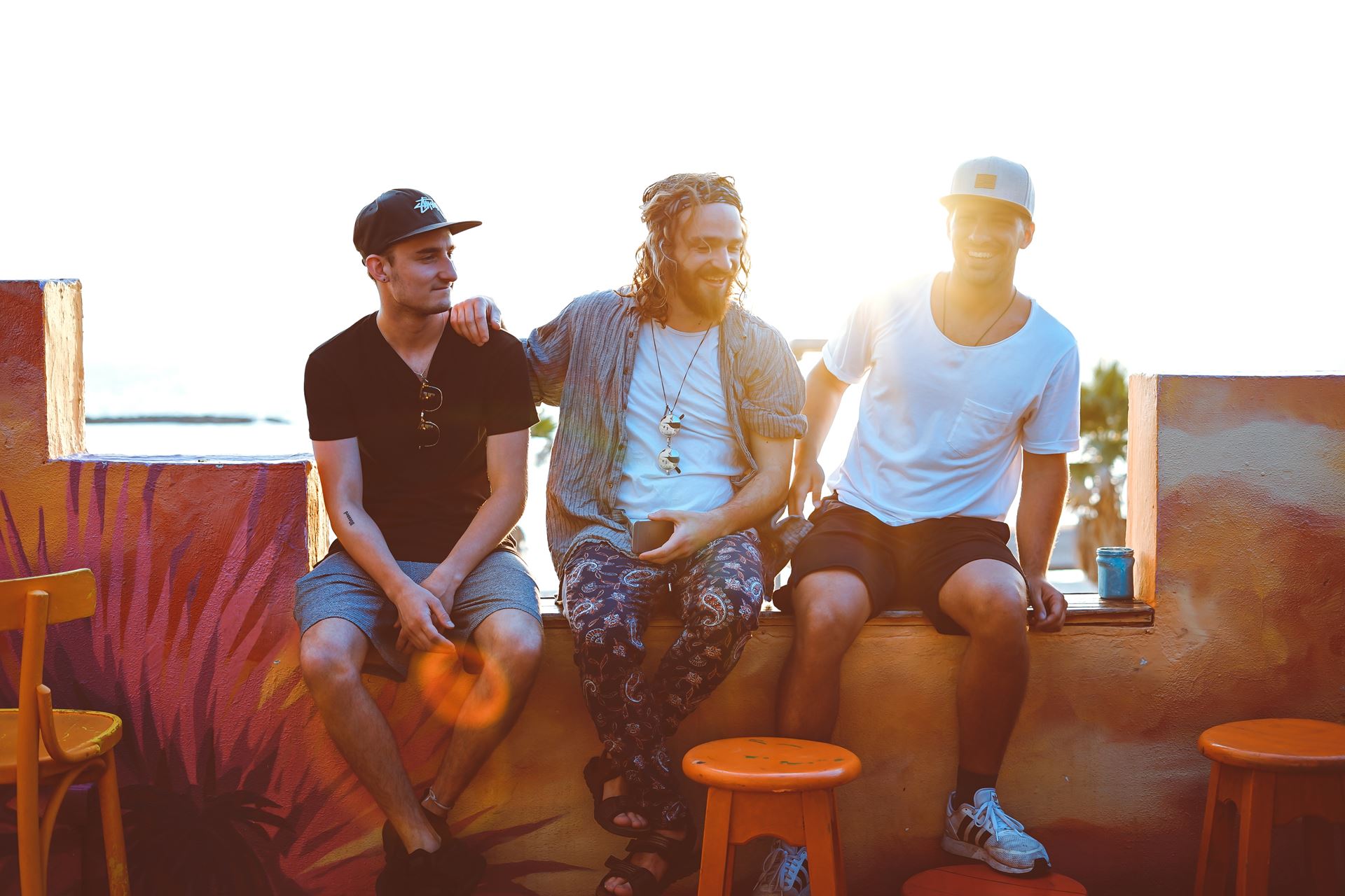 a group of men sitting on a bench